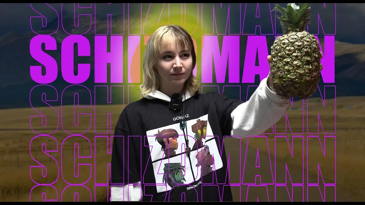 SCHIZOMANN title card: an actor holds up a pineapple in front of a wide field